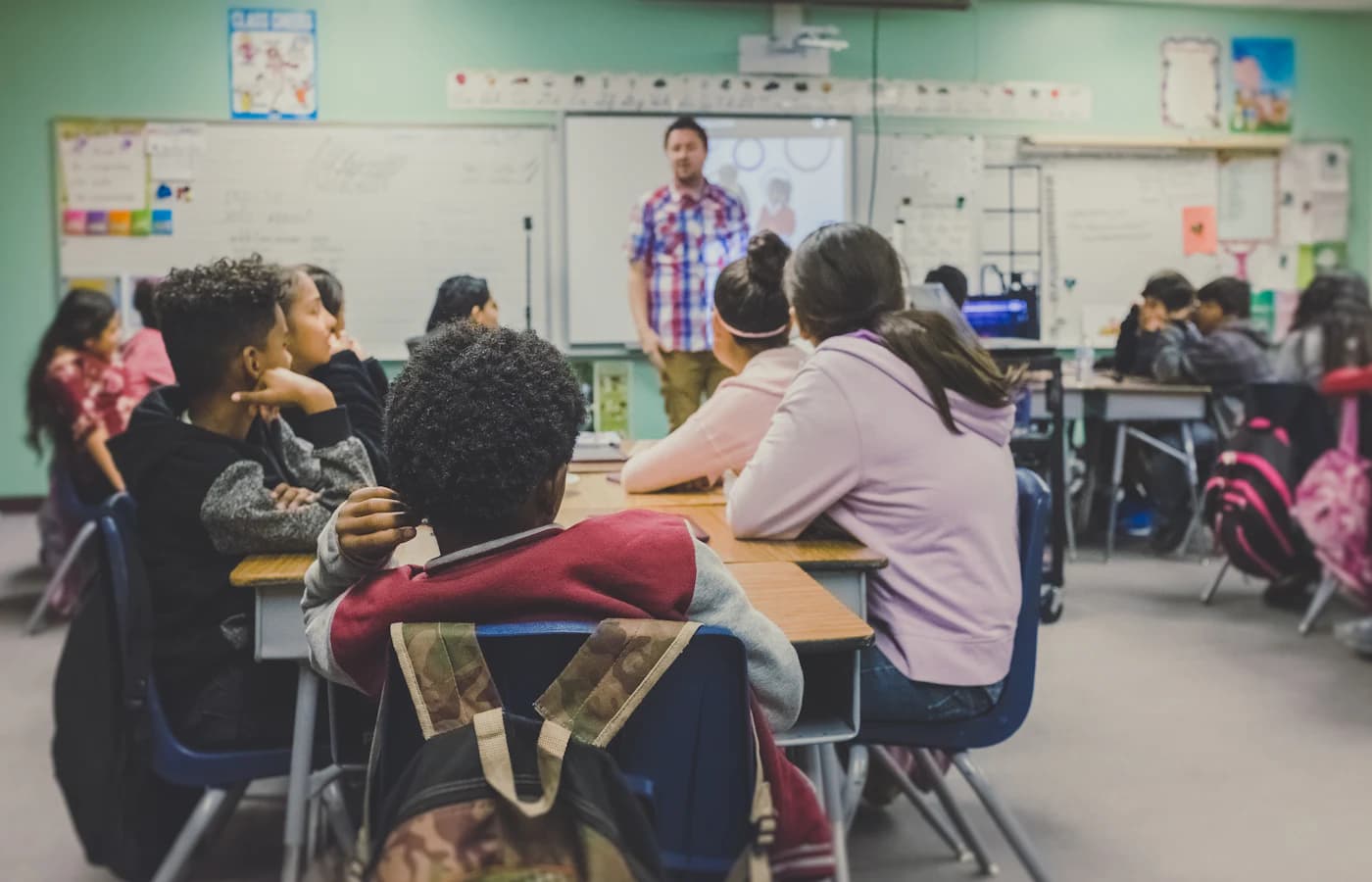 Teacher with students in a classroom
